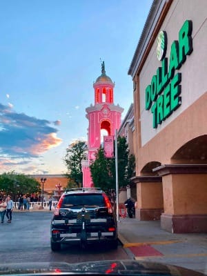 Casa Bonita rising pinkly beyond the Dollar Tree