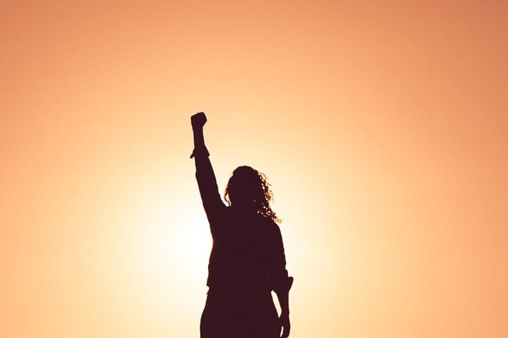 woman with her fist in the air